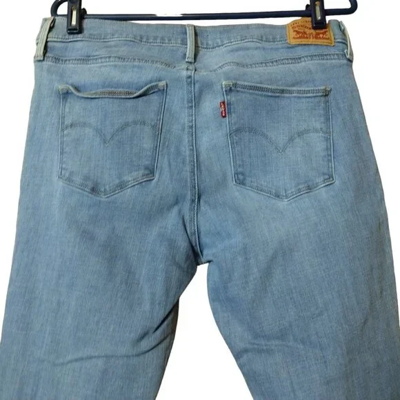 Levi’s Women's Size 33 Slimming Skinny Distressed Light Blue Mid-Rise Jeans - Picture 5 of 6